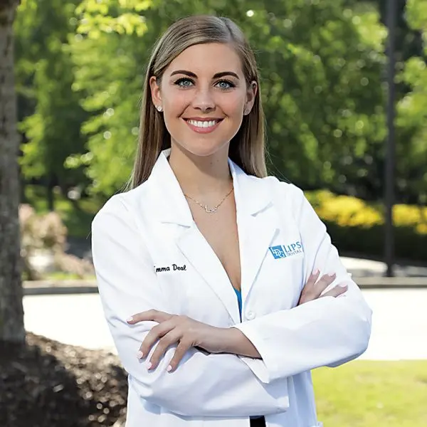 Image of Emma Deal, DMD in a white coat smiling.