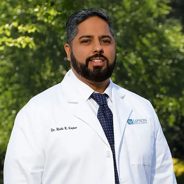 Image of Dr. Rishi Kapur in a white coat smiling.